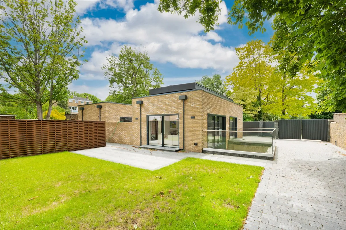 Catherine Road, Surbiton Modern single-storey house with large windows and landscaped garden.